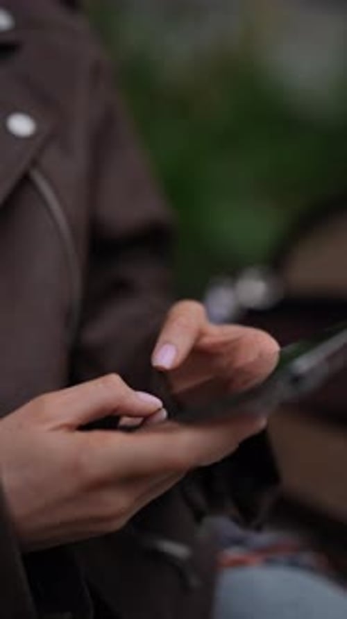 Vertical Cropped Shot of Unrecognizable Busy Woman Using Typing Smartphone in City on Cloudy Day