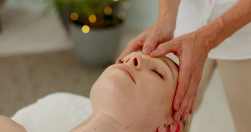 Spa, hands and head massage on bed for wellbeing lifestyle with professional masseuse service