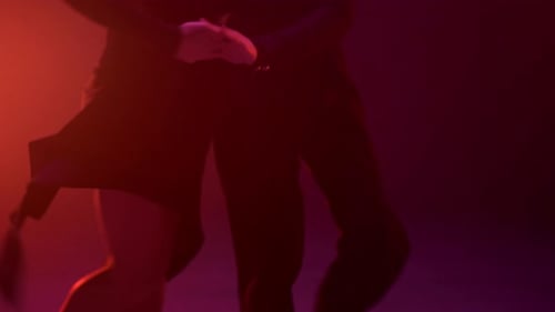 Unknown Sensual Ballroom Pair Performing in Dark Space. Unrecognizable Sexy Couple Dancing