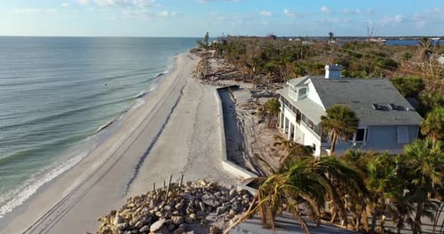 Storm Surge Caused By Hurricane Wind Severe Damaged Residential Houses on Ocean Shore Natural