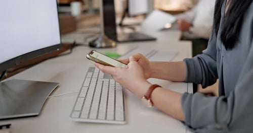 Phone, hands and closeup of a businesswoman in the office networking on social media