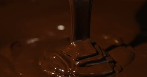Closeup view of flowing delicious melted chocolate
