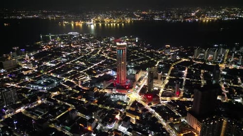 Penang George Town at night with a tall building KOMTAR in the middle