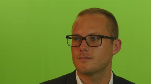 Young Caucasian Man in Suit Isolated on Green Screen Background