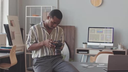 Portrait of African American Male Photographer in Studio