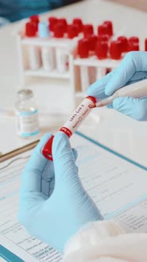 Medical Professional Working with Test Tube in Lab