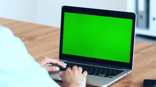 Woman Networking on Laptop with Green Chroma Key Screen