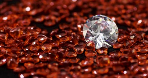 Diamond Surrounded by Decorative Orange Heart-Shaped Stones