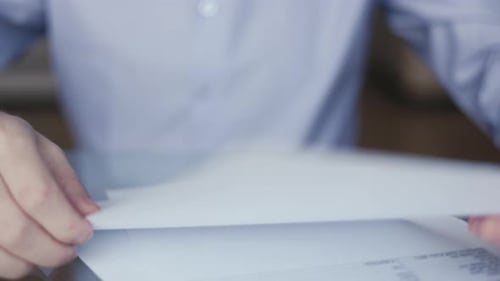 Businessman Crumples a Paper Document An Office Worker Rips Paper