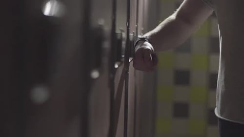 Athlete Opening and Closing Locker Room Door