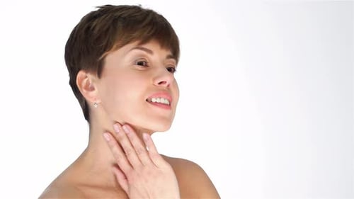 Woman Gently Touching Her Face in Close Up