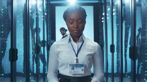 A Professional in a Data Center Using a Tablet That Demonstrates Modern Technology Advancements