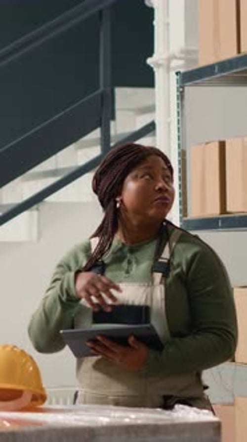 Vertical Video Warehouse Employee Managing Inventory