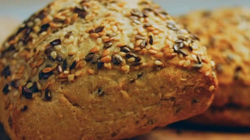 Two Freshly Baked Square Loaves of Bread with Seeds