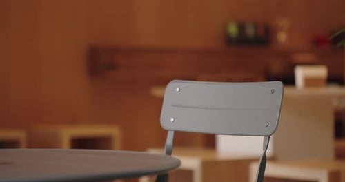 Selective Focus on Empty Chair Near Table in Cozy Cafe