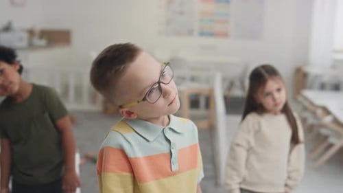 Children Stretching Necks in Classroom Exercise