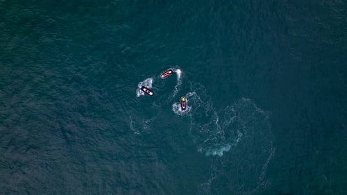Jetskis standing on the Ocean