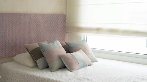 girl's room with bed and cushions