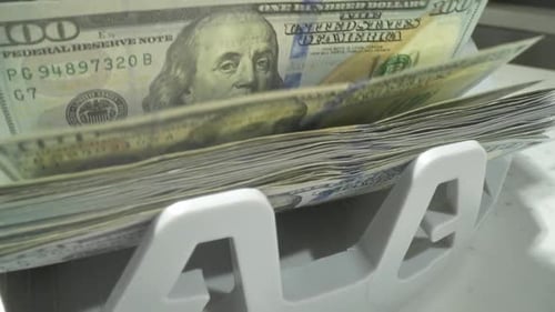 Money Counter Processing US Hundred Dollar Bills