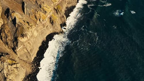 Dramatic Aerial View of Ocean Waves Crashing on Coast