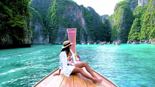 Pileh Lagoon with Green Emerald Ocean at Koh Phi Phi Thailand Women in Front of Longtail Boat