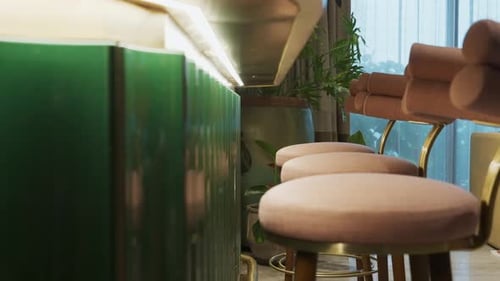 Fluted Lava Stone Bar Counter With Comfy Upholstered Bar Stools. sliding shot