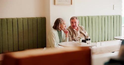 Happy, talking and senior couple at restaurant for bonding, conversation and relax together