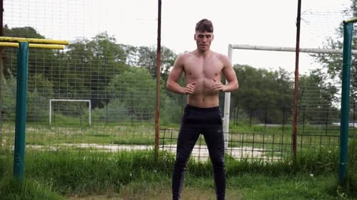 Male Shirtless Athlete Doing Squats at Sports Ground Young Sportsman Working at Summer Nature Strong