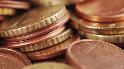 Macro shot of stacked euro currency coins zooming