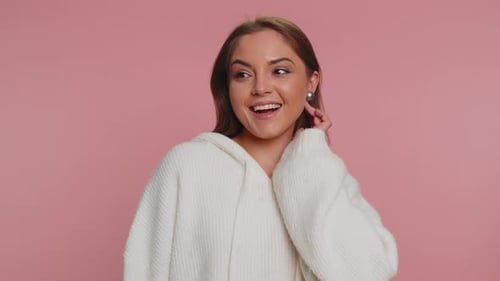 Attractive Woman Smiling and Posing in White Sweater