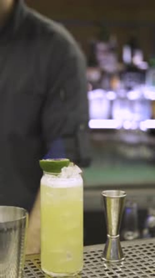 Bartender Making Cocktail with Fire and Cinnamon