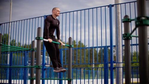 Impressive Muscleup Exercise By Athlete on Outdoor Bar