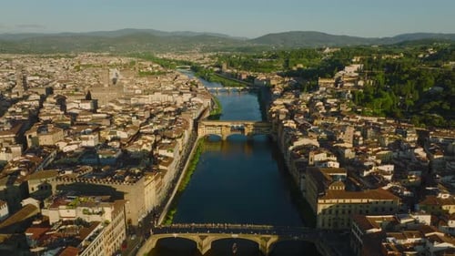 Aerial View of Old Bridge Ponte Vecchio Across Arno River in Tourist Attractive Historic Town at