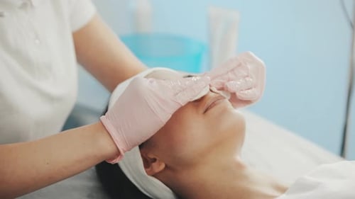 Close up view of woman that lying down in spa salon and have face cleaning procedure