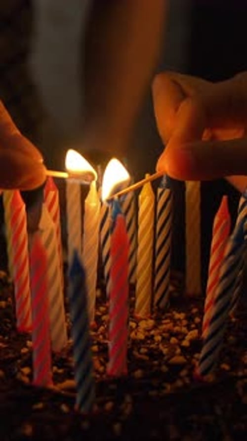 Lighting Candles on a Delicious Chocolate Birthday Cake