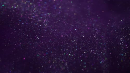 Glittering Multicolored Bokeh Particles Rising on Purple Backdrop