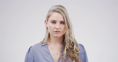 Portrait of a blonde woman looking at camera