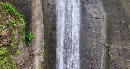 An exquisite view of a waterfall, mountains, and lush greenery captured at Bridal Falls near Baguio
