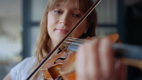 Woman with Light Brown Hair Plays Violin