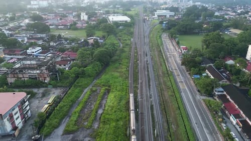 Aerial look down train move at suburban area