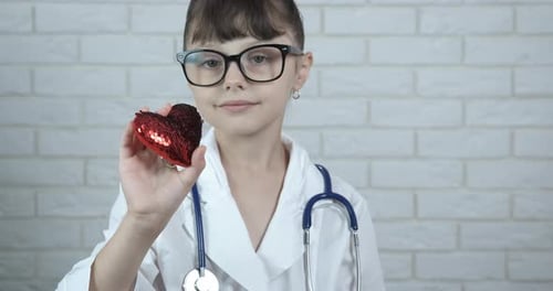 Girl Doctor Presents Decorative Heart