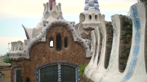 Mosaic Tile Roofs Of Casa del Guarda Gatehouse At Park Guell In Barcelona, Catalonia, Spain. - wide