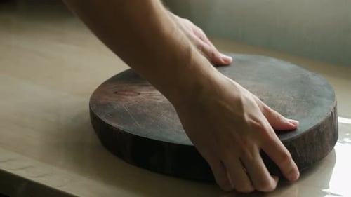Wooden Cutting Board Placed on Shiny Table