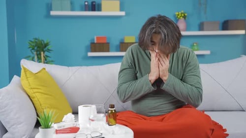 Un homme agacé s'ennuie, en a assez de la maladie.