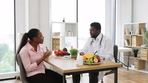 Doctor Advises Patient About Healthy Diet in Office