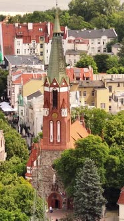Vertical drone shot around the Kościół św. Jerzego w Sopocie church, in Sopot