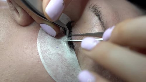 Eyelash Extension Application Close Up in Beauty Salon