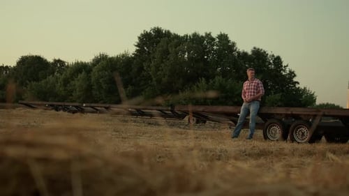 Farmer Work Wheat Field at Machine Rural Area View. Professional Mature Businessman