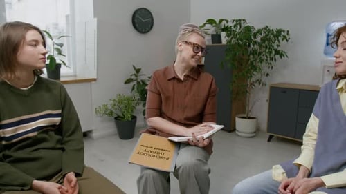 Four Women Sitting in Circle During Group Therapy Session