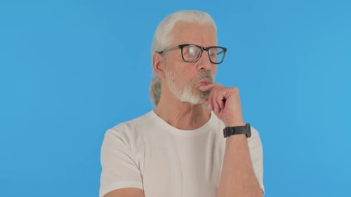 Casual Old Man Brainstorming New Idea on Green Background, Portrait